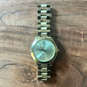 Rose gold Michael Kors watch. Nice condition with minor wear. Needs battery.